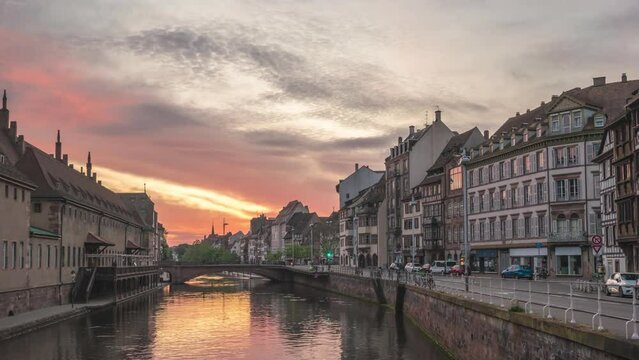 Strasbourg France time lapse 4K, city skyline night to day sunrise timelapse at Ill River with colorful half timber house