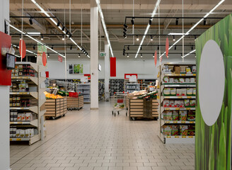 Supermarket Aisles Brim With Goods In This Image