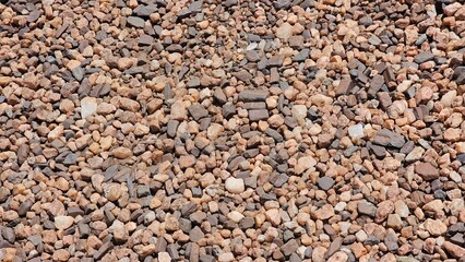 textured background of small pebbles in Namibia, showcasing the rugged desert landscape with natural stones scattered across the ground