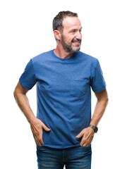 Fototapeta premium Middle age hoary senior man over isolated background looking away to side with smile on face, natural expression. Laughing confident.