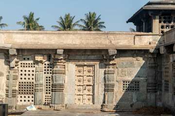 Beautiful geometric designs and patterns on the walls and wooden door of the ancient Chennakeshava temple in Belur.