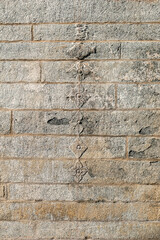 Beautiful decorative designs on the ancient stone walls of the Chennakeshava temple in Belur in Karnataka.