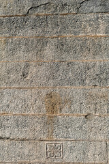 Beautiful decorative designs on the ancient stone walls of the Chennakeshava temple in Belur in Karnataka.