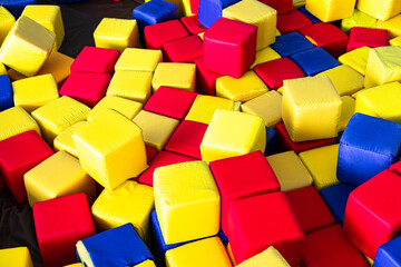 Fototapeta na wymiar Kids playground with soft multi-colored cubes