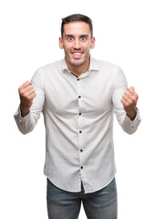 Fototapeta premium Handsome young business man screaming proud and celebrating victory and success very excited, cheering emotion