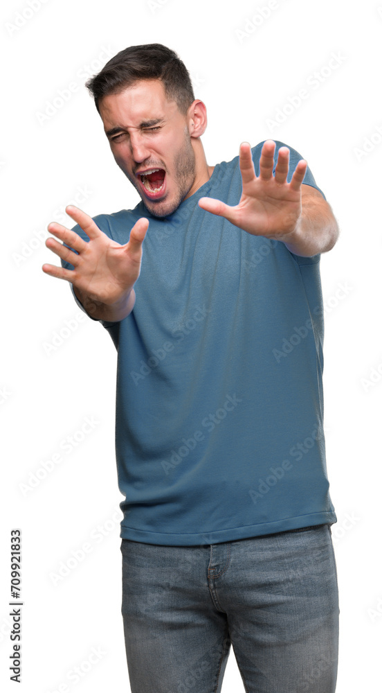 Sticker handsome young casual man afraid and terrified with fear expression stop gesture with hands, shoutin