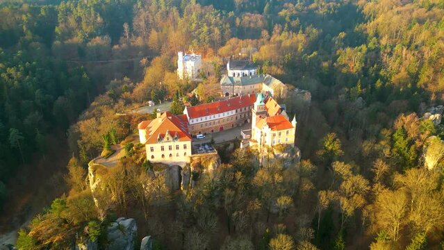 Hruba Skala chateau on the sandstone cliff in Bohemian Paradise, Czech: Cesky raj. Cold morning sunrise. Aerial 4K footage from above