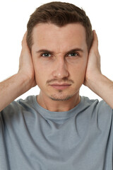 Obraz premium caucasian man in t-shirt covers ears with hands on white background