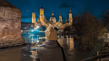 Nighttime Postcard in Zaragoza: Silhouette against Basilica del Pilar, Ebro River, and Stone...