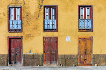 Yellow house with simple doors and balconies in Sal Rei .  Spirit of Boa Vista island : traditional...