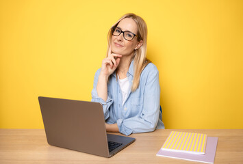 Young smiling successful secretary employee business woman in casual shirt sit work at office desk...