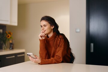 Lonely Young Woman Messaging on Smartphone at Home, Feeling Upset in Casual Interior