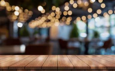 Foto op Plexiglas Empty wooden table top with lights bokeh on blur restaurant background. © DEEP PIXEL
