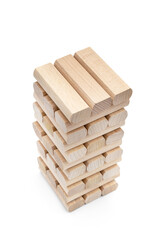 Falling tower of wooden blocks on white. Child's toy. - 709954696