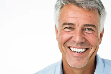 Fotobehang a closeup photo portrait of a handsome old mature man smiling with clean teeth. for a dental ad. guy with fresh stylish hair and beard with strong jawline. isolated on white background © PixelGallery