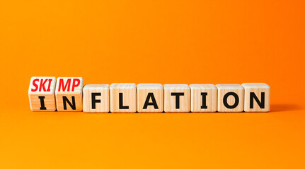 Inflation or skimpflation symbol. Concept words Inflation Skimpflation on beautiful wooden blocks....