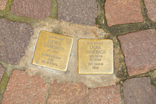 Stolpersteine project, stumbing stones on the pavement in front of former home of family Hainebach