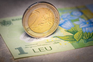 Romania euro, Romania joining the euro zone, Financial concept, Coin 1 Romanian leu and 2 euro,...