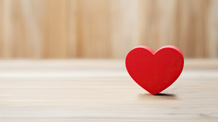 red heart on wooden background