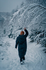 Fototapeta na wymiar Person walking in the snow
