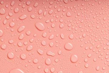 Poster At the top is a close-up video photo of water droplets on a peach background © metelevan