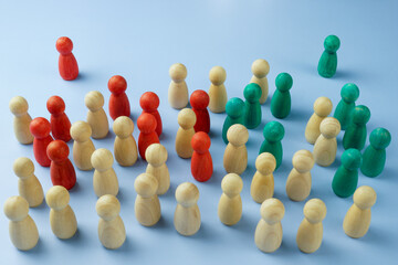 Wooden figures and two as opinion leaders or influencers.