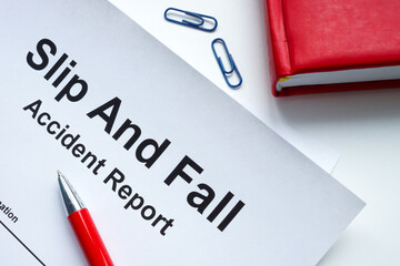 Slip and fall accident report and notepad.