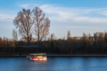 Single boat in the harbor of Schierstein/Germany at sunset in spring