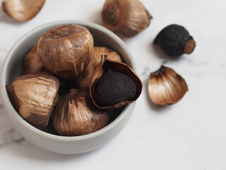Aged black garlic, healthy food eating with high antioxidants.