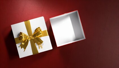 top view of white red present box tied with golden ribbon bow or blank gold ribbon bow gift box open on dark red background with shadow minimal conceptual 3d rendering