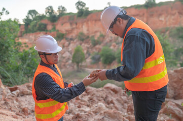 Geologist surveying mine,Explorers collect soil samples to look for minerals.