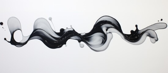 Oil spills create abstract shapes on white paper.