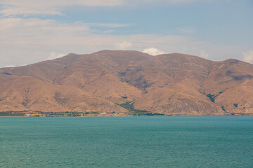 View of the biggest lake in Armenia, Sevan Lake. Mountain around. - 709986880