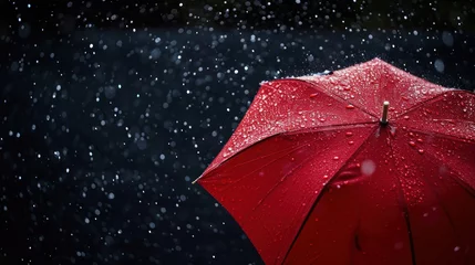  Red Umbrella and Rain Against Black Background © EmmaStock
