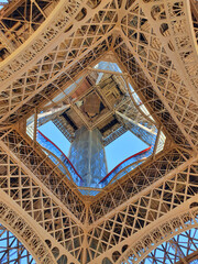 Captivating Eiffel Tower beneath the radiant sunlight, an iconic symbol of Paris gracefully shining in the dawn. A breathtaking moment of architectural beauty