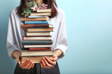 Female hands holding pile of books over light blue background. ai generative