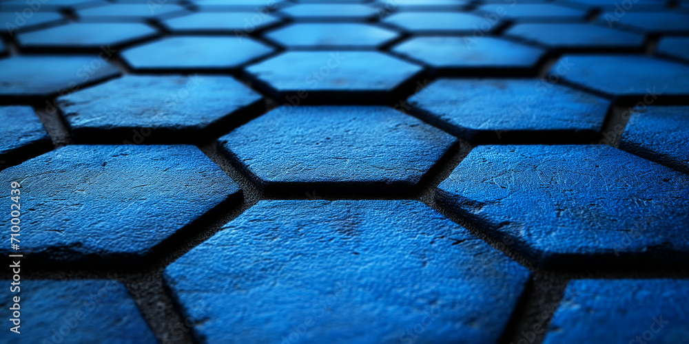 Poster close-up of a surface with blue hexagonal tiles, creating a textured pattern that feels modern and design-oriented