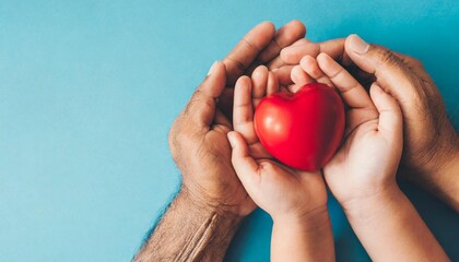 family holding red heart on hands health theme or world health day