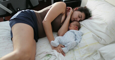 Candid real life newborn baby sleeping with mother in bed - obrazy, fototapety, plakaty