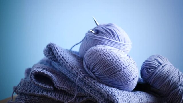 Set for hand knitting, blue yarn, knitting needles.
