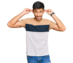 Young handsome man wearing casual clothes smiling pulling ears with fingers, funny gesture. audition problem