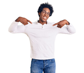 Handsome african american man with afro hair wearing casual clothes and glasses looking confident...