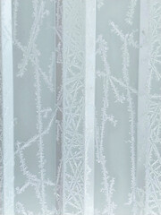winter vertical frosty background with snow patterns on ribbed texture
