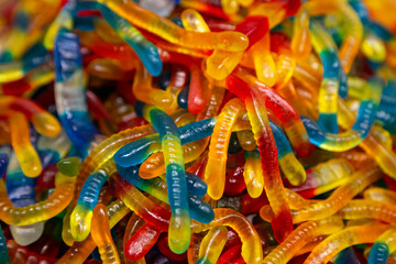 Fototapeta na wymiar Candy background, chewing jelly candies in the form of worms, close-up.