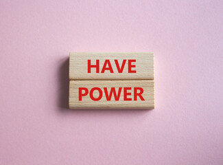 Have power symbol. Wooden blocks with words have power. Beautiful pink background. Business and have power concept. Copy space.