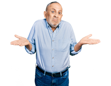 Senior man with grey hair and beard wearing casual blue shirt clueless and confused expression with arms and hands raised. doubt concept. - Powered by Adobe