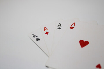 Four aces playing cards isolated on white background