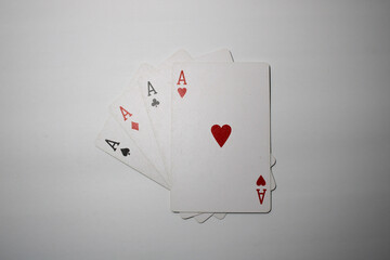 Four aces playing cards isolated on white background