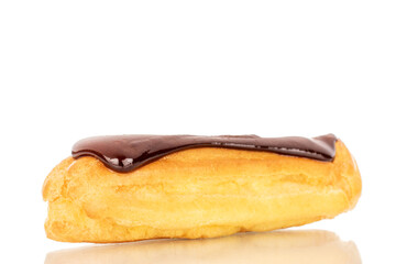 One delicious chocolate eclair, close-up isolated on white.