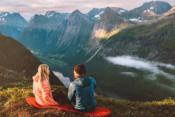 Couple traveling together Valentines day holiday romantic dating in mountains vacations outdoor man and woman enjoying view family relationship active healthy lifestyle tour in Norway - 710033693